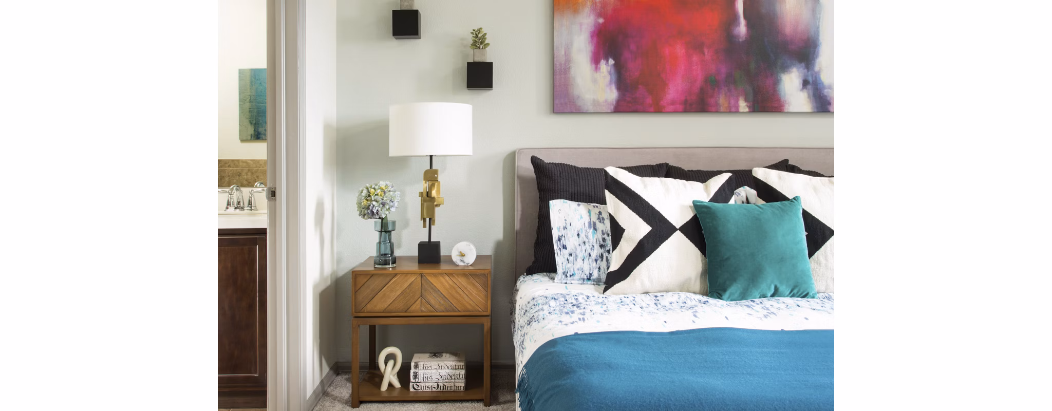Cozy bedroom with modern decor at Griffis at Lowry Apartments