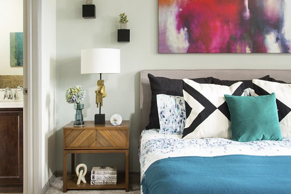 Cozy bedroom with modern decor at Griffis at Lowry Apartments