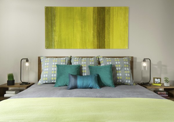 Spacious bedroom with modern decor at Griffis at Lowry Apartments