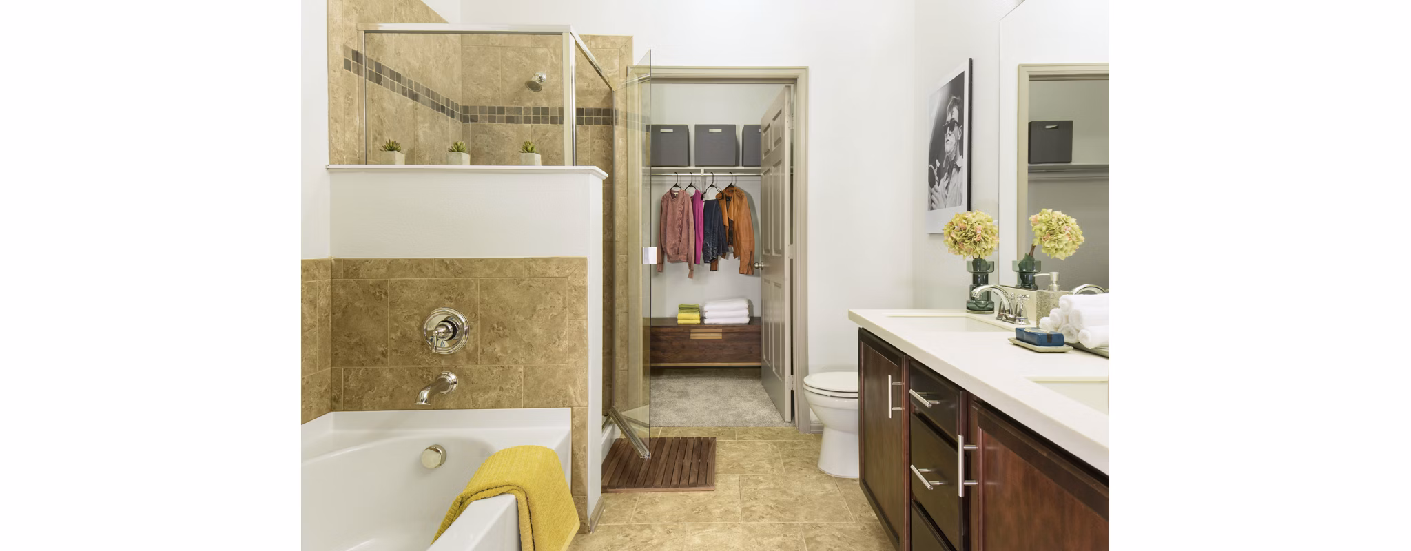 Elegant bathroom with modern fixtures featuring spacious vanity at Griffis at Lowry Apartments