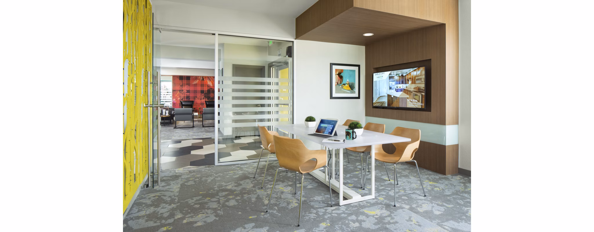 Business center with modern workstations at Griffis at Lowry Apartments