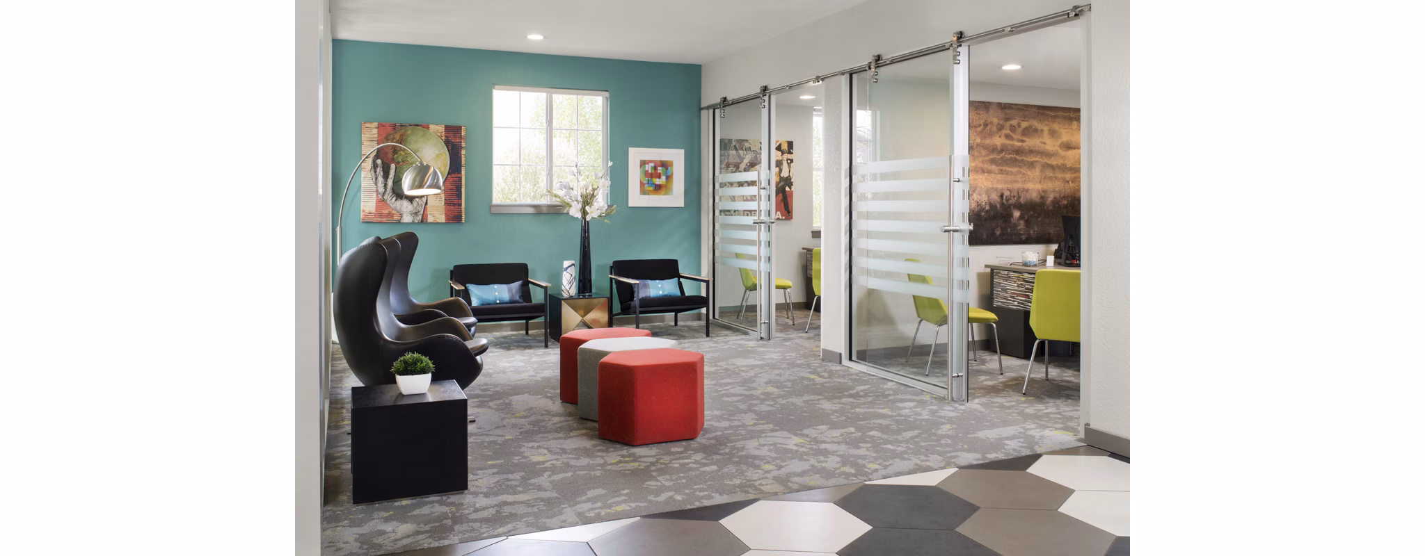 Clubhouse featuring modern design elements at Griffis at Lowry Apartments in Denver, offering luxury amenities for residents