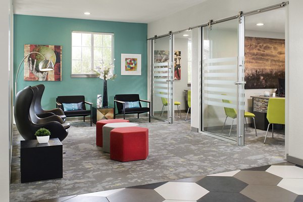 Clubhouse featuring modern design elements at Griffis at Lowry Apartments in Denver, offering luxury amenities for residents
