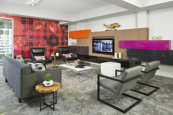 Modern clubhouse with stylish furnishings at Griffis at Lowry Apartments, offering luxury amenities and spaces for residents to relax and socialize