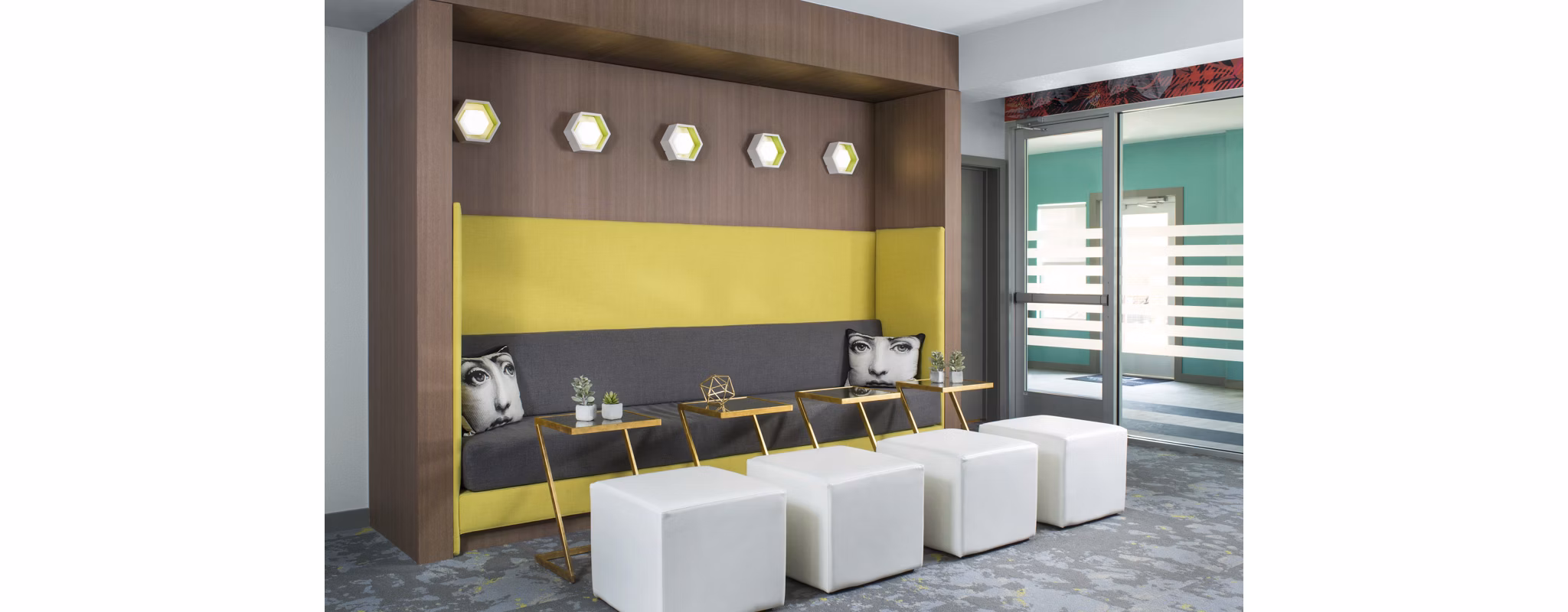 Modern clubhouse with stylish seating and open spaces at Griffis at Lowry Apartments