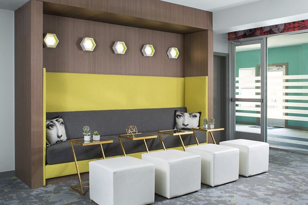 Modern clubhouse with stylish seating and open spaces at Griffis at Lowry Apartments
