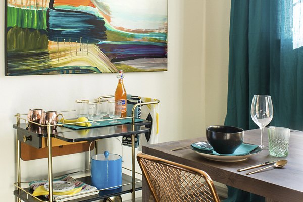Stylish dining area with modern furnishings at Griffis at Lowry Apartments