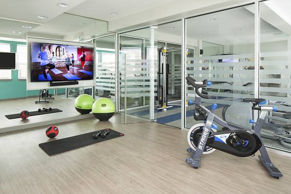 fitness center at Griffis at Lowry Apartments