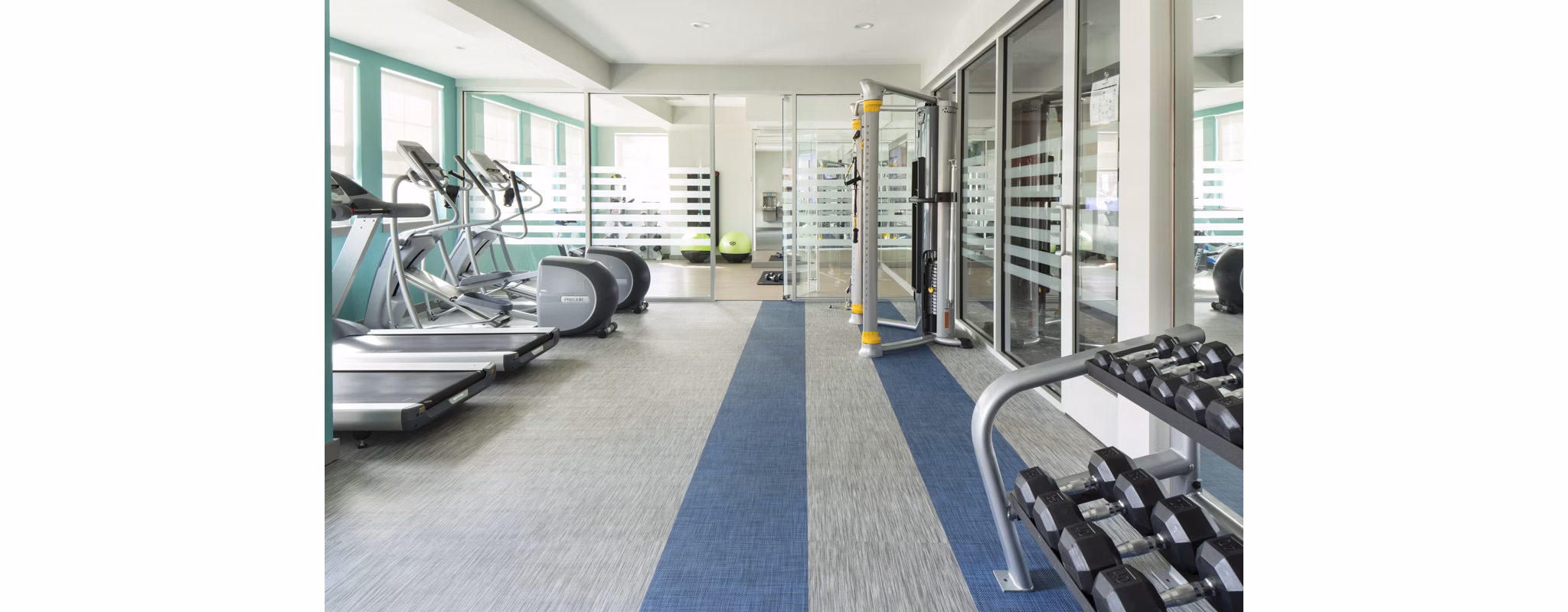 Fitness center featuring modern exercise equipment at Griffis at Lowry Apartments
