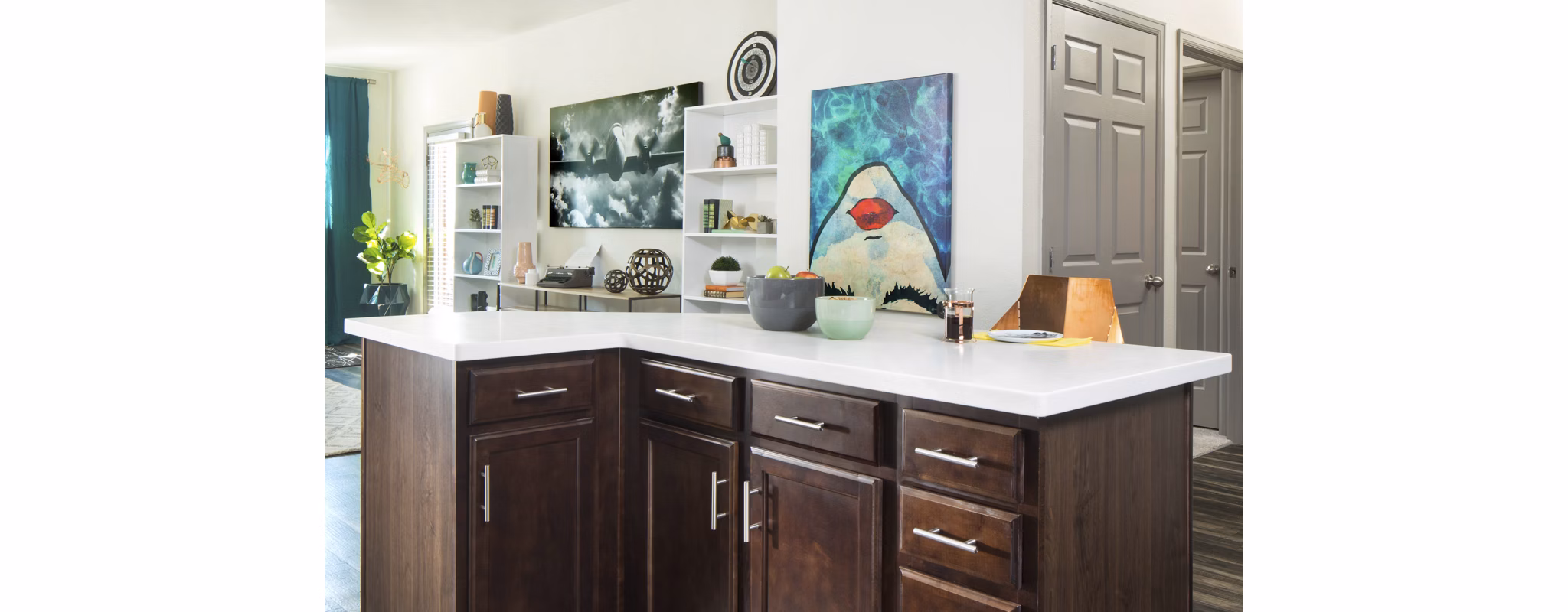 Griffis at Lowry Apartments: Modern kitchen with stainless steel appliances and quartz countertops