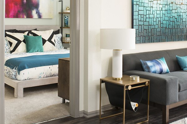Spacious living room with modern decor at Griffis at Lowry Apartments