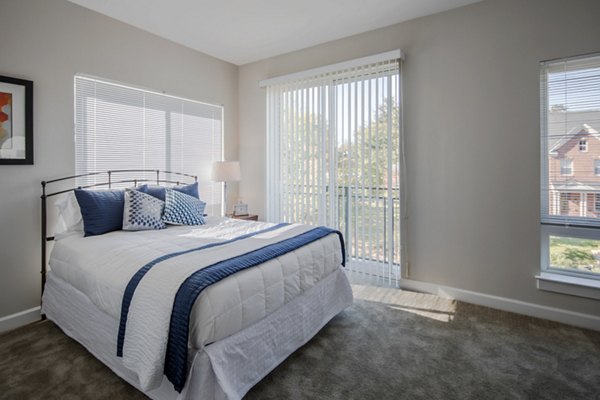Modern bedroom with chic decor at Loren Apartments, Greystar luxury apartments, featuring a stylish bed and natural lighting Perfect for urban living