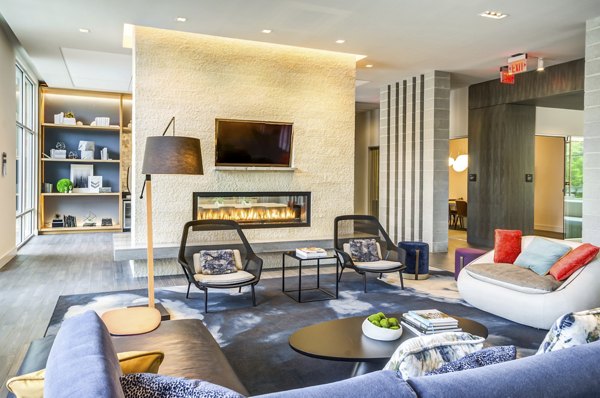 Clubhouse featuring modern design elements and comfortable seating at Loren Apartments luxury community