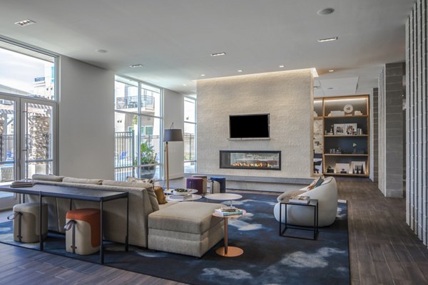 Clubhouse featuring modern design and entertainment areas at Loren Apartments luxury community