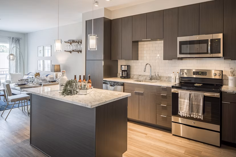 Modern kitchen featuring stainless steel appliances in Loren Apartments, Greystar's luxury housing option