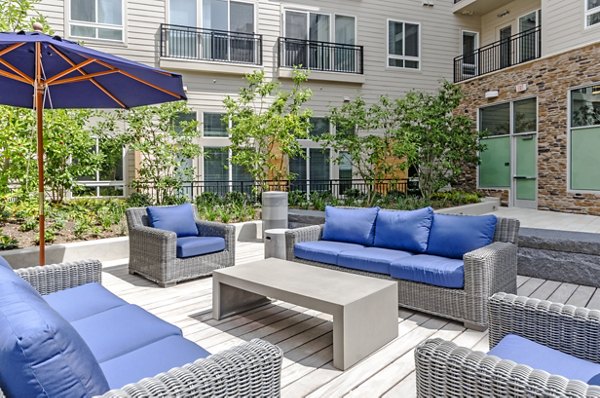Modern courtyard at Loren Apartments with lush landscaping and seating areas, offering a tranquil retreat in the heart of the community