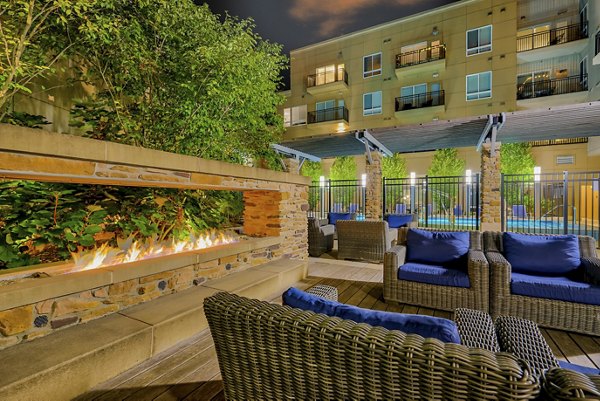 Luxury apartment living room with modern furnishings and large windows in an upscale community