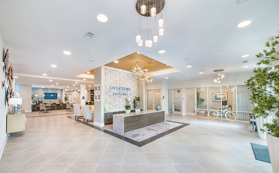 Clubhouse with modern decor and cozy seating at Overture Chapel Hill Apartments for a luxury living experience