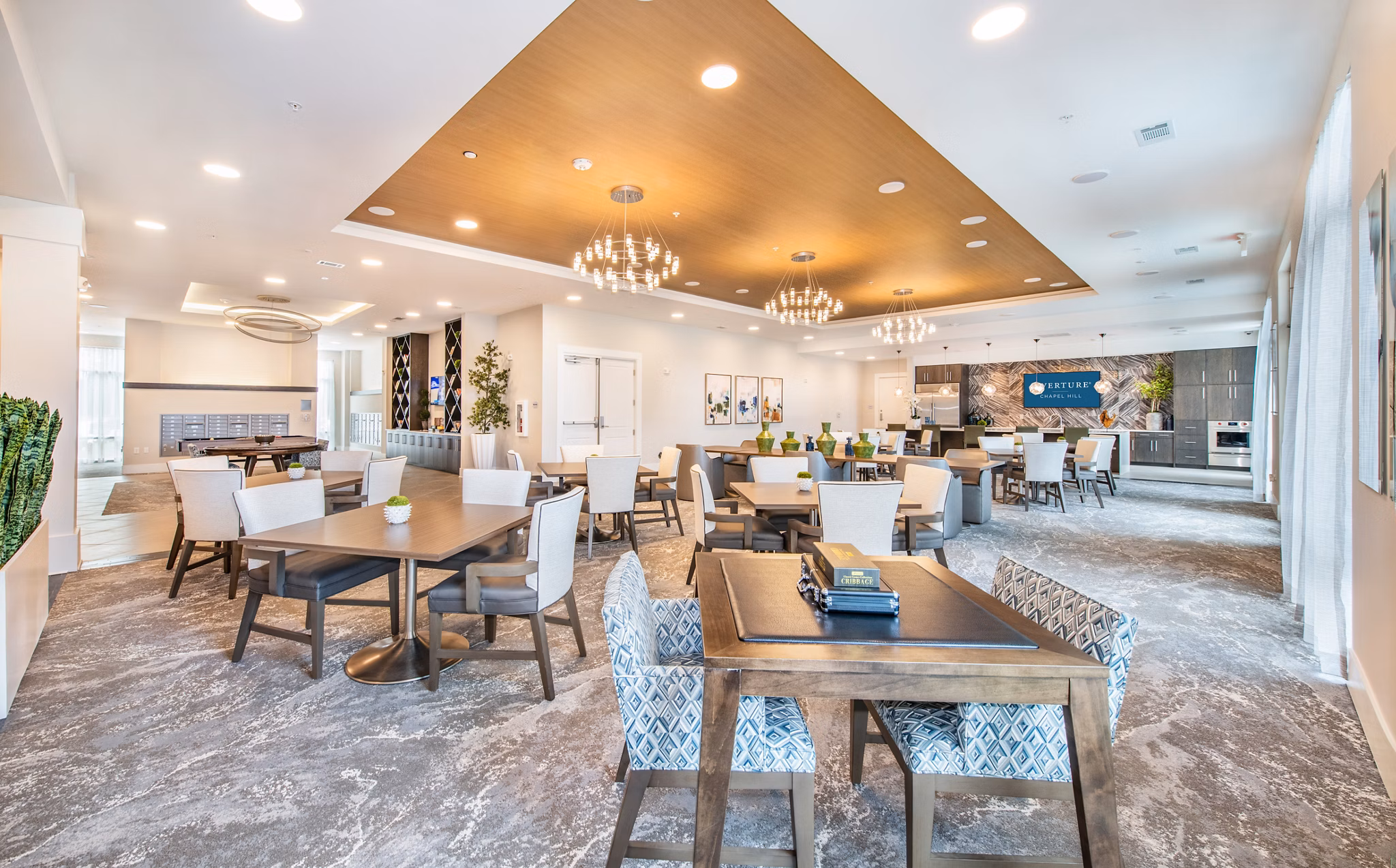 Clubhouse featuring modern lounge areas at Overture Chapel Hill Apartments, a luxury community in desirable Chapel Hill location