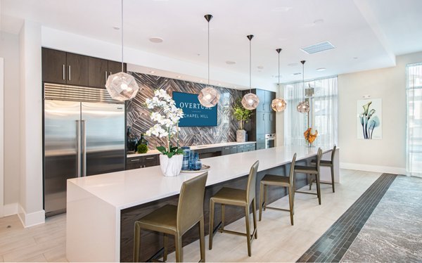 Clubhouse featuring cozy lounge and modern decor at Overture Chapel Hill Apartments