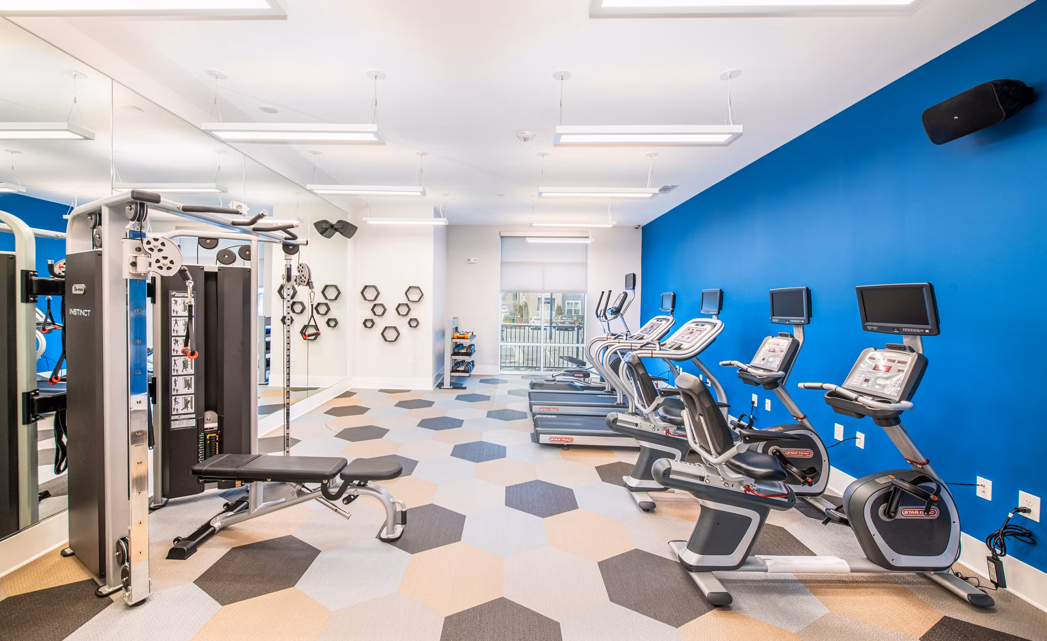 Spacious fitness center with modern equipment at Overture Chapel Hill Apartments for an active lifestyle