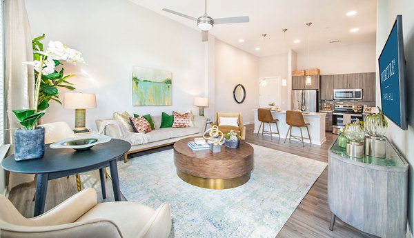 Spacious living room with modern decor and natural light in Overture Chapel Hill Apartments, a luxury community by Greystar