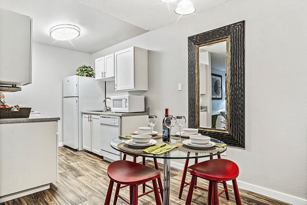 Dining area with modern furnishings and natural light at Kendall Ridge Apartments