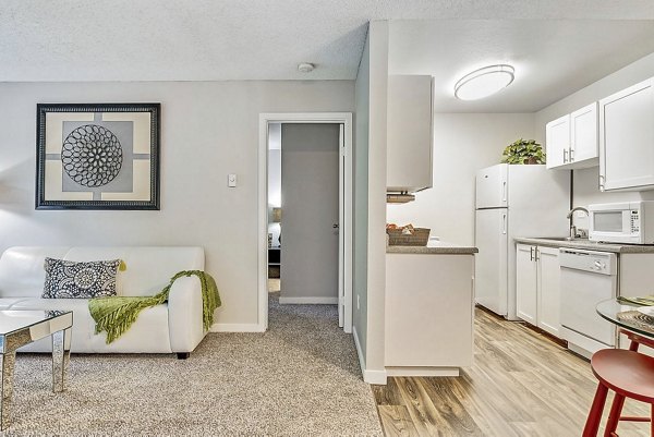 Spacious living room with modern decor and large windows in Kendall Ridge Apartments