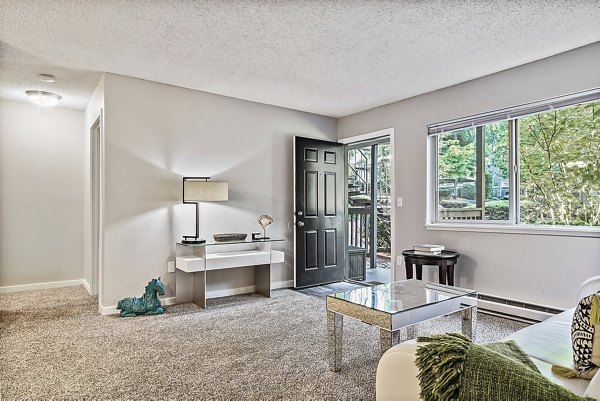 Living room featuring modern decor and ample natural light at Kendall Ridge Apartments