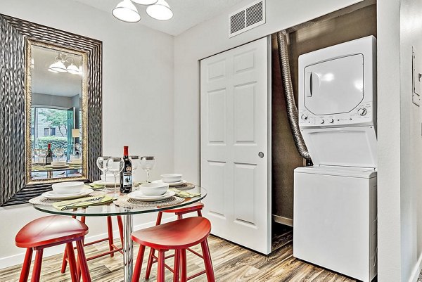Laundry room featuring modern appliances at Kendall Ridge Apartments