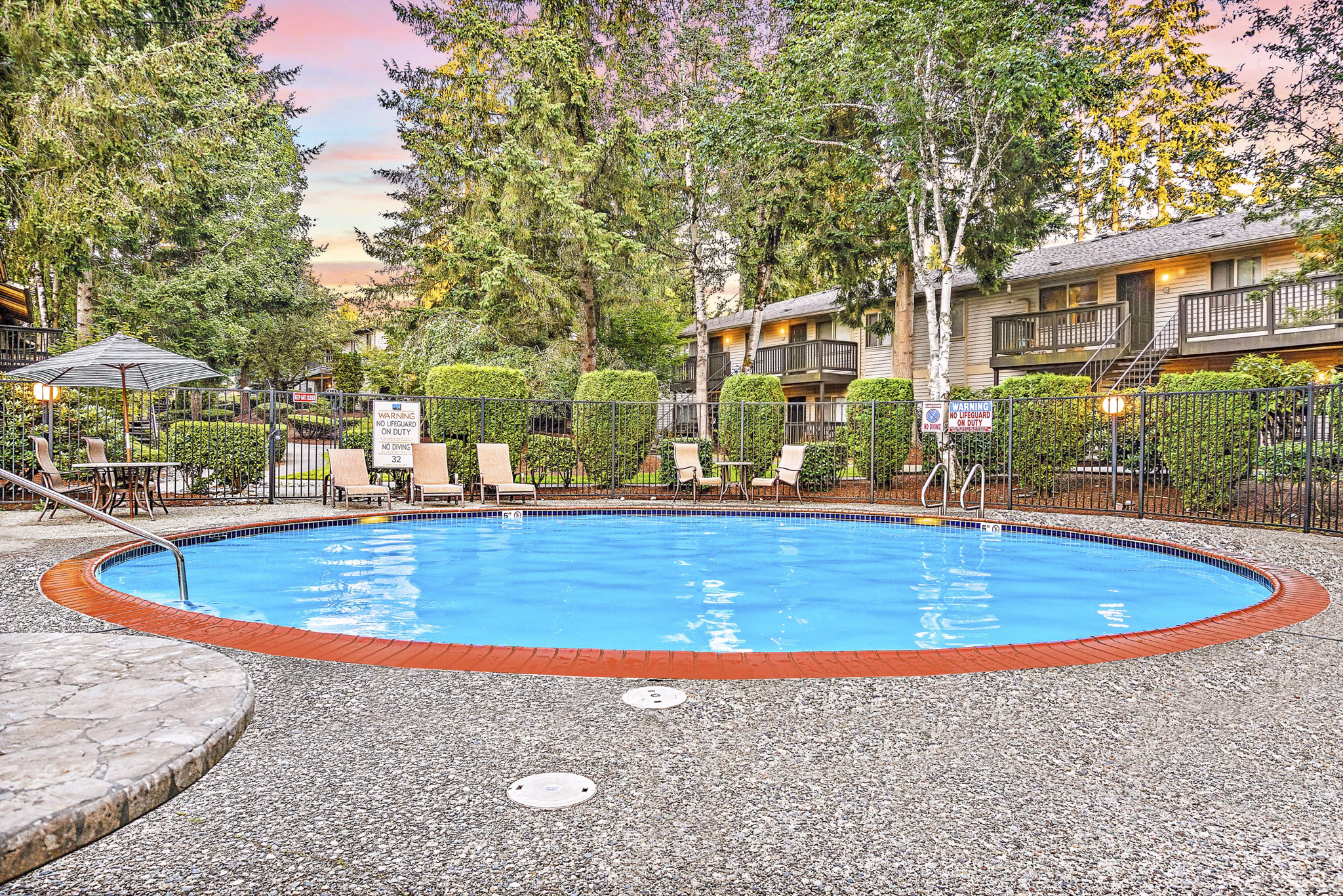 Resort-style pool with lounge chairs at Kendall Ridge Apartments