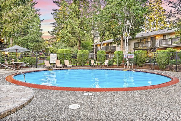 Resort-style pool with lounge chairs at Kendall Ridge Apartments