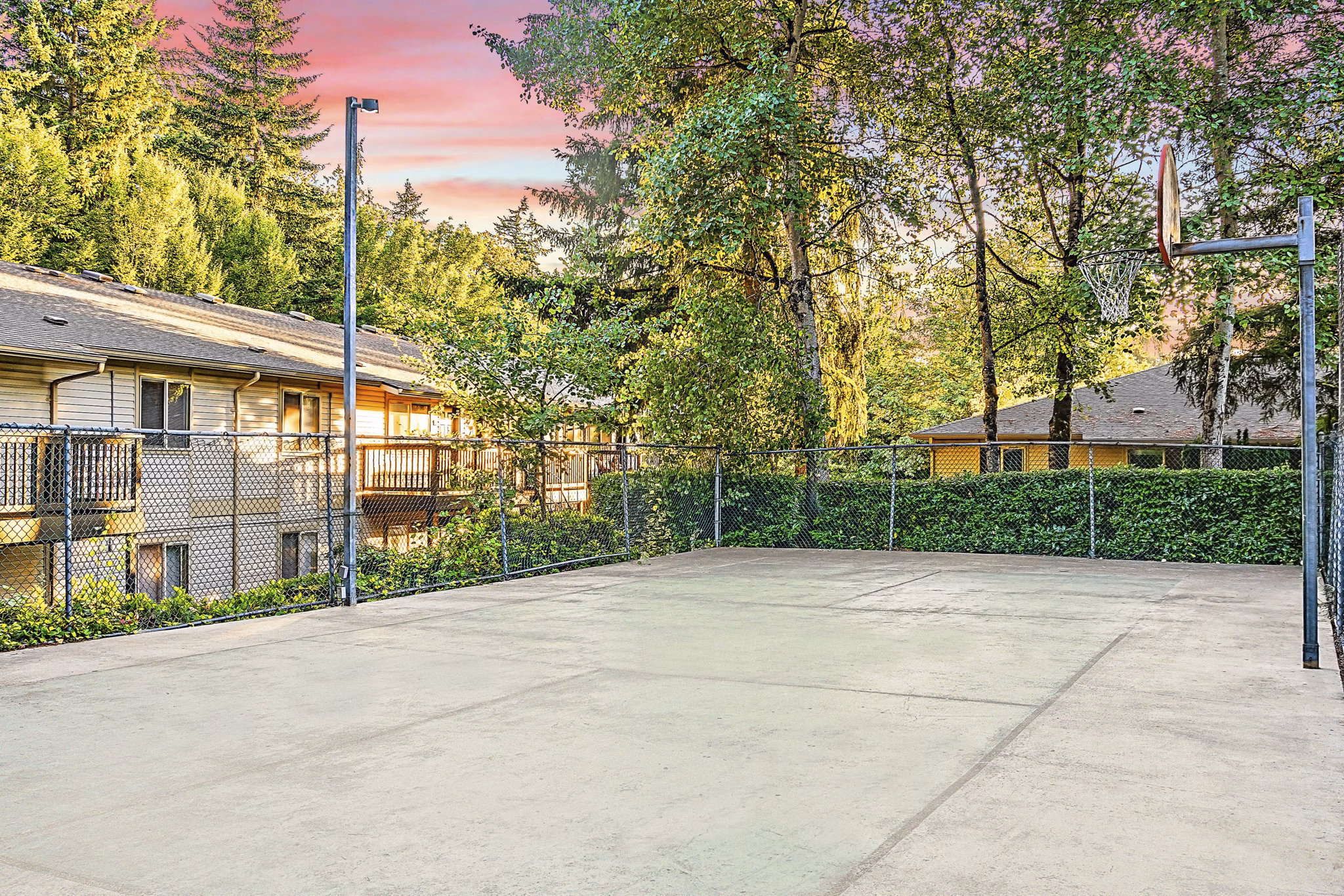 Sport court at Kendall Ridge Apartments: Outdoor recreation area featuring tennis and basketball courts