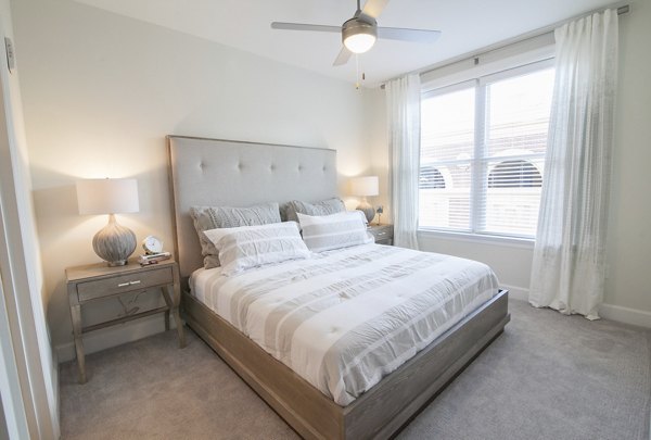 Modern bedroom with stylish decor at Amorance Apartments