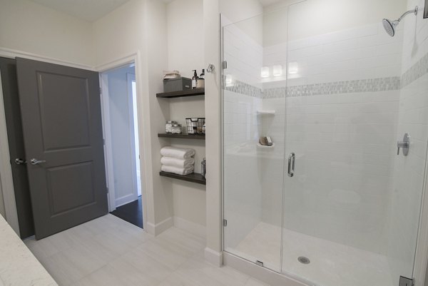 Modern bathroom with sleek fixtures at Amorance Apartments, a Greystar luxury community