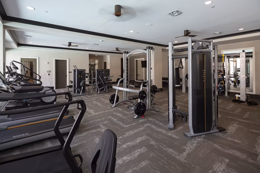 Fitness center with state-of-the-art equipment at Amorance Apartments, offering a luxurious workout experience for residents