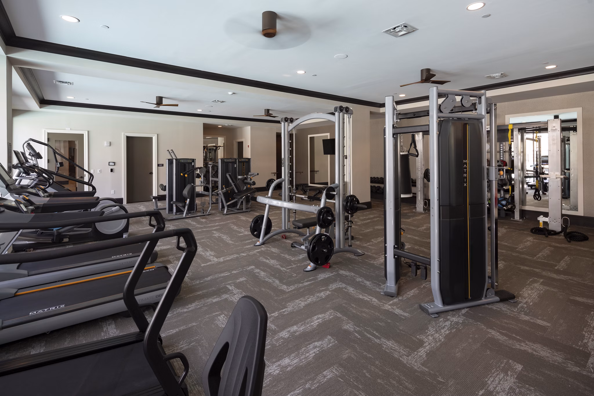Fitness center with state-of-the-art equipment at Amorance Apartments, offering a luxurious workout experience for residents