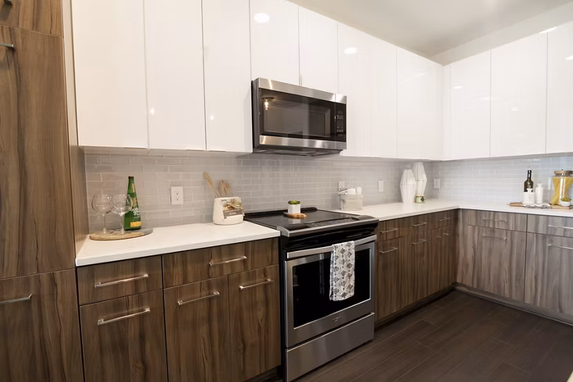 Modern kitchen with sleek cabinetry and stainless steel appliances at Amorance Apartments