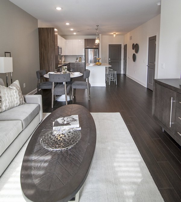 Spacious living room with modern decor at Amorance Apartments, luxury living in prime location