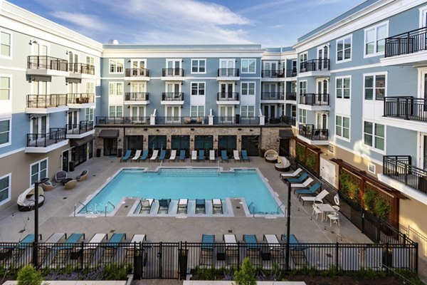 Resort-style pool with cabanas at Amorance Apartments