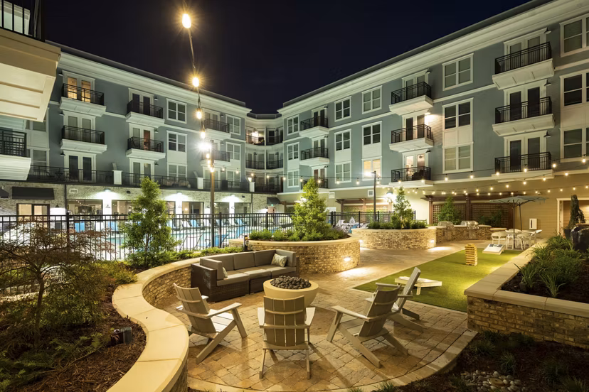 Courtyard with lush landscaping and seating at Amorance Apartments, luxury living environment