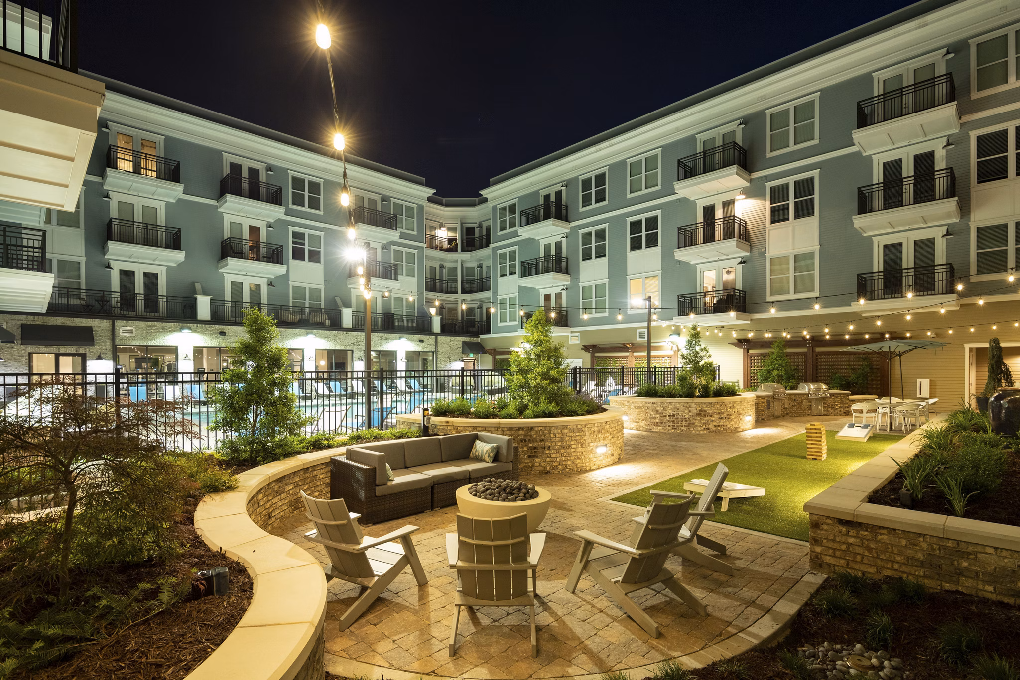 Courtyard with lush landscaping and seating at Amorance Apartments, luxury living environment