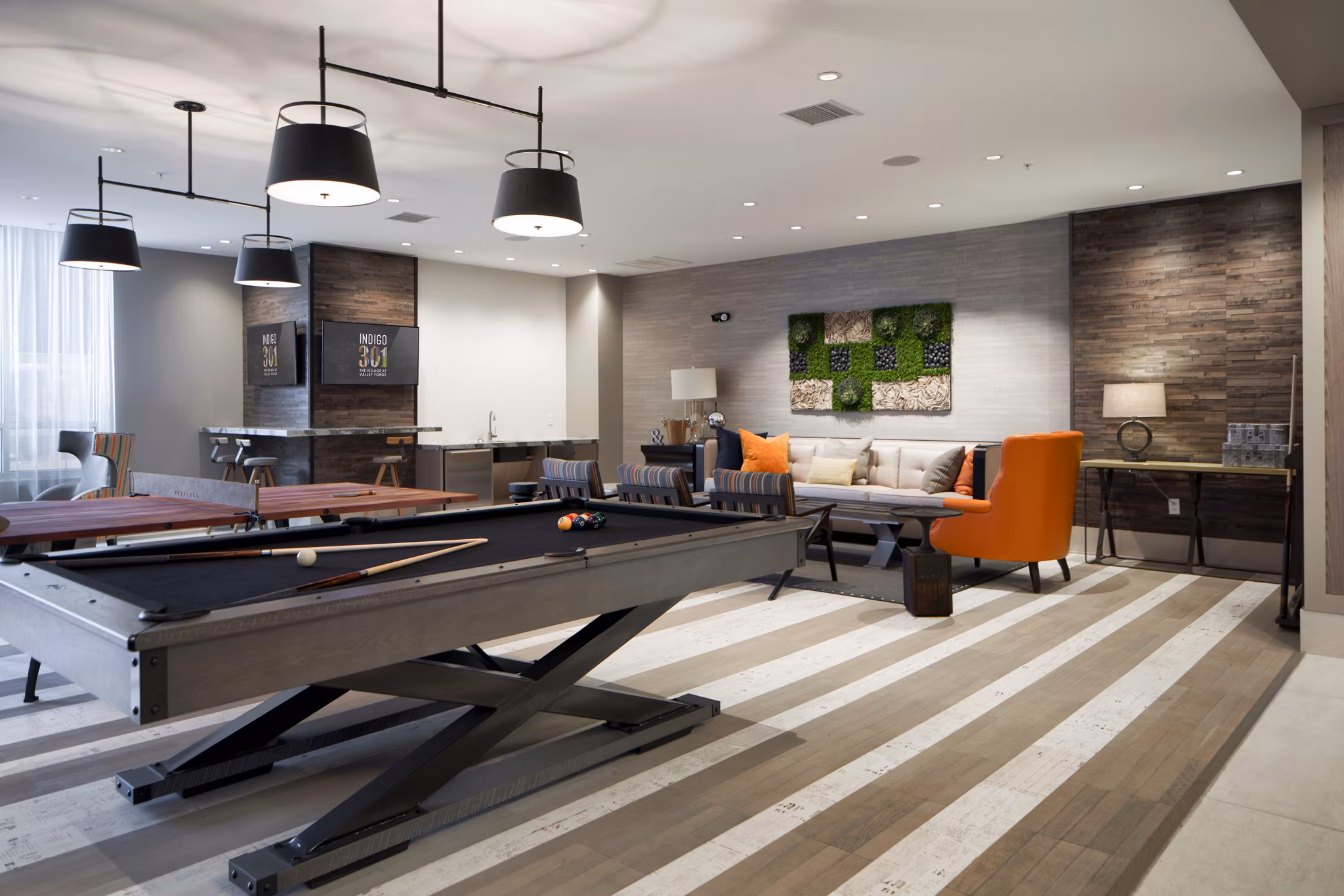 Modern clubhouse featuring lounge seating at Indigo 301 Apartments, luxury community lifestyle