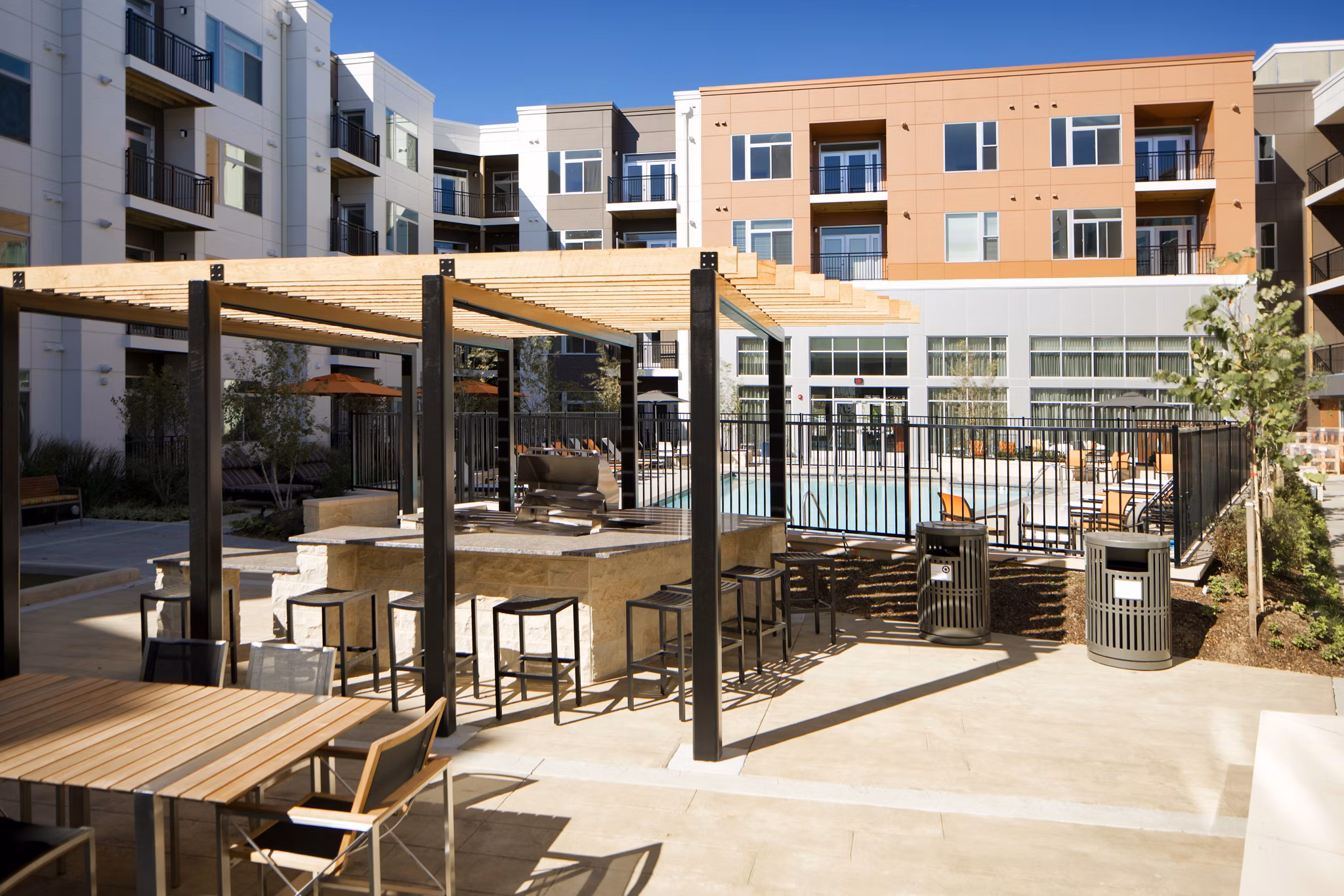 Outdoor BBQ grill area at Indigo 301: luxury apartment community offering residential conveniences