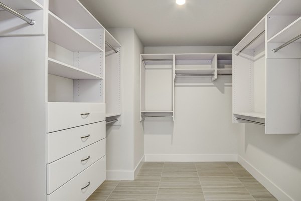 Walk-in closet with custom shelving at Alluvion Las Olas Apartments