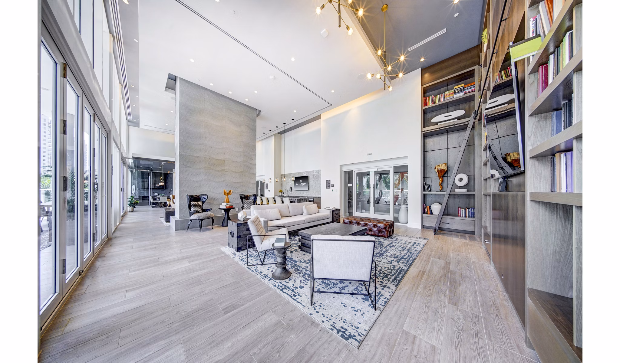 Modern clubhouse with cozy seating and entertainment areas at Alluvion Las Olas Apartments