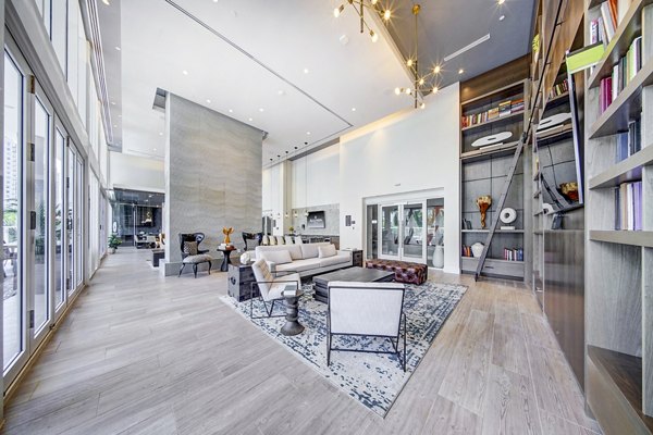Modern clubhouse with cozy seating and entertainment areas at Alluvion Las Olas Apartments