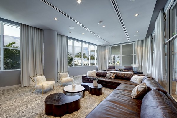 Clubhouse featuring modern design and comfortable seating at Alluvion Las Olas luxury apartments in a vibrant setting