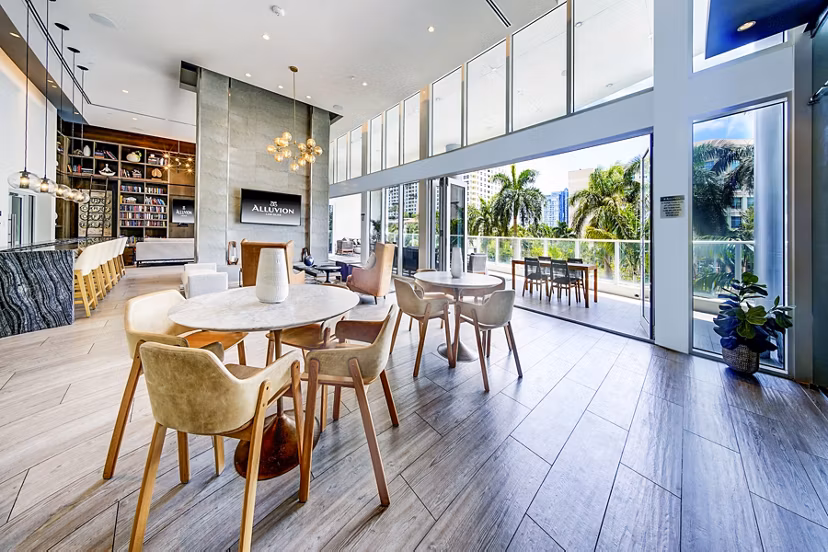 Modern clubhouse with vibrant decor at Alluvion Las Olas Apartments, offering luxury living spaces in Fort Lauderdale