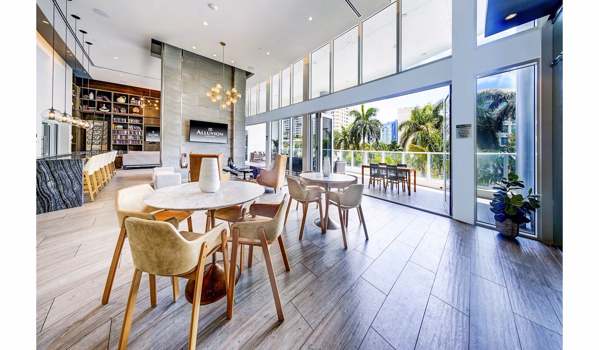 Modern clubhouse with vibrant decor at Alluvion Las Olas Apartments, offering luxury living spaces in Fort Lauderdale